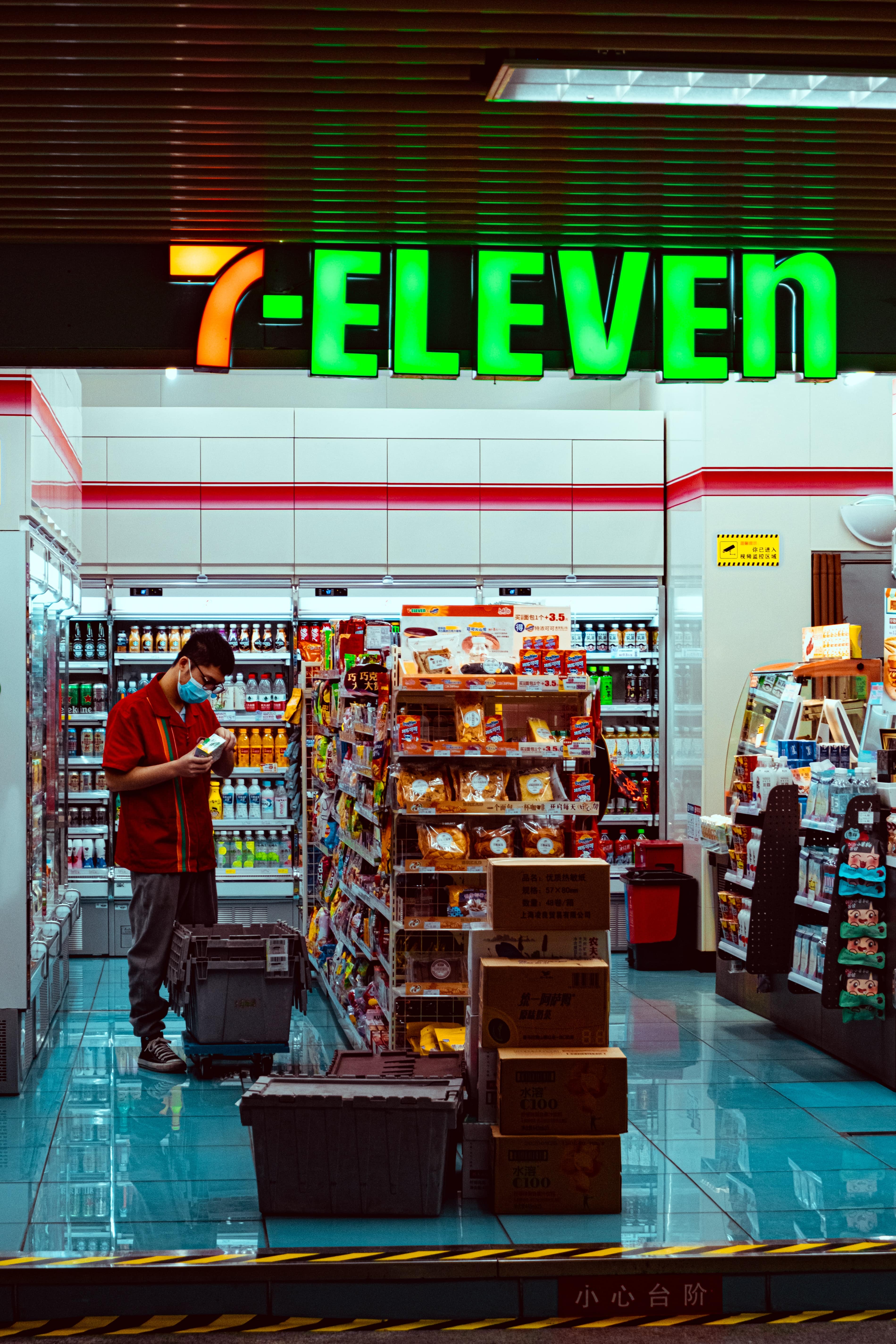 Man in red standing in 7-11